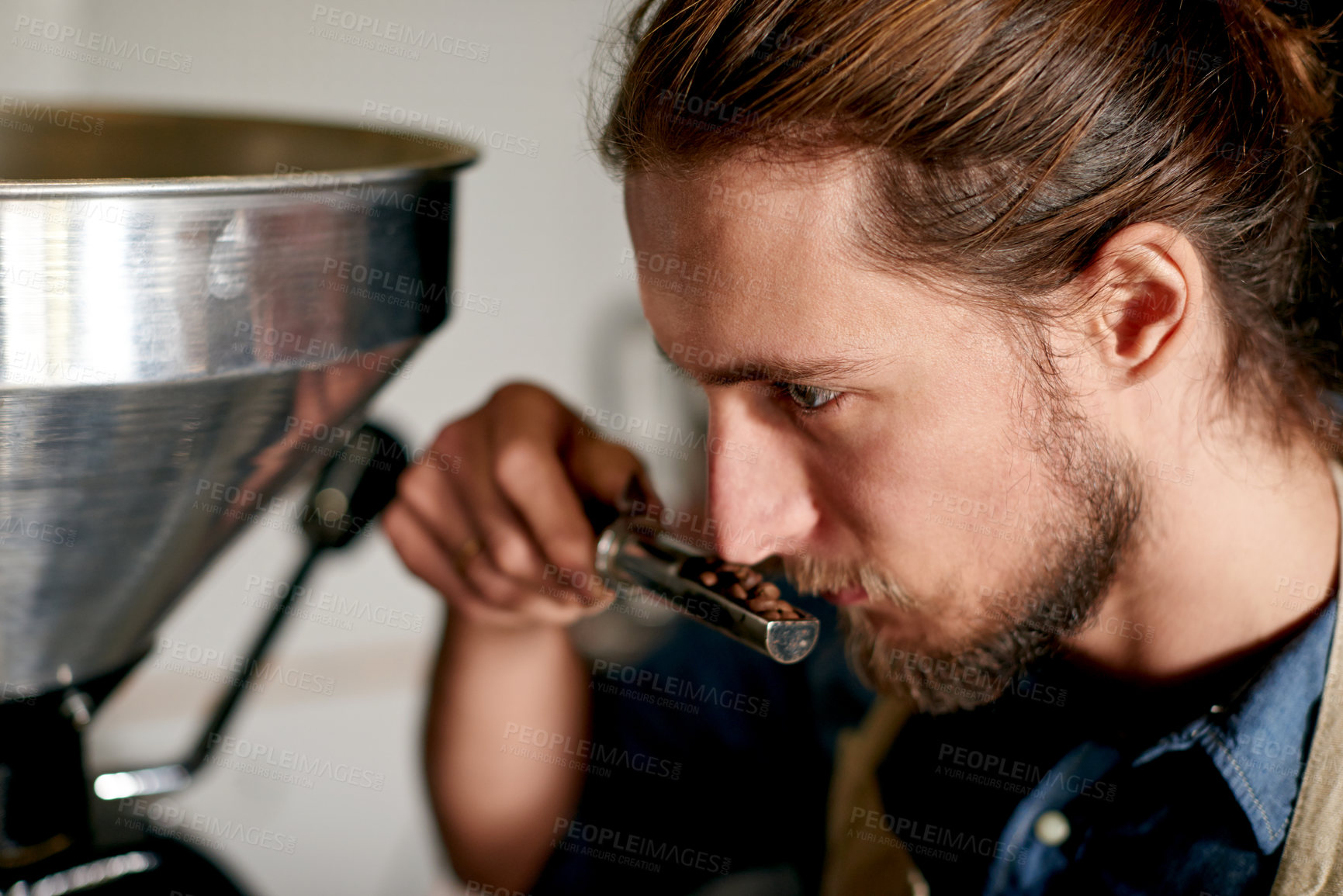 Buy stock photo Smelling, coffee beans and man with machine, cafe and inspection of caffeine, server and small business. Scent, employee and barista with seeds for beverage, morning and person with aroma of product