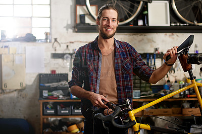 Buy stock photo Portrait, workshop and man with startup, bike repair and maintenance with pride, smile and confidence. Person, entrepreneur and business owner with restoration expert, happiness and professional
