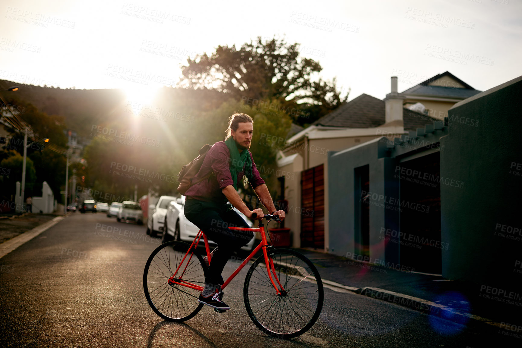 Buy stock photo Travel, adventure and man on bicycle in town for sightseeing, journey or carbon footprint on holiday. Street, cycling and person on bike for eco friendly transport on vacation in urban city at sunset
