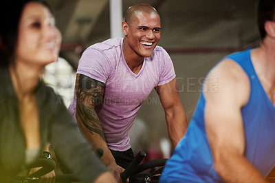 Buy stock photo Smile, spin class or man on cycling equipment in training exercise for wellness, health or fitness. Active, challenge or happy athlete on bicycle machine for workout, body or cardio in gym community