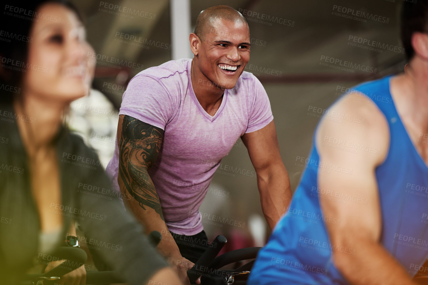 Buy stock photo Smile, spin class or man on cycling equipment in training exercise for wellness, health or fitness. Active, challenge or happy athlete on bicycle machine for workout, body or cardio in gym community