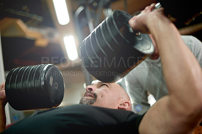 Buy stock photo Personal trainer, weights and man in gym with dumbbell for exercise, fitness and bodybuilder training. Sports, coach and people with equipment for bench press, muscle strength and workout challenge