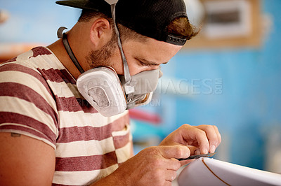 Buy stock photo Mask, PPE and man with surfboard, razor and creative for skills, talent and hobby. Craftsman, artist and entrepreneur with workshop for design, manufacturing and custom work for artisan craft