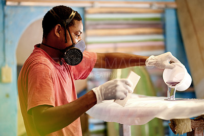 Buy stock photo Workshop, PPE and black man with surfboard, resin and creative for skills, talent and hobby. Craftsman, artist and entrepreneur with mask for design, manufacturing and custom work for artisan craft