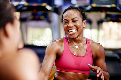 Buy stock photo Exercise break, woman and talking at gym with resting, routine progress and fitness advice. Friends, happy athletes and relax with conversation at sports center for workout pause or training feedback