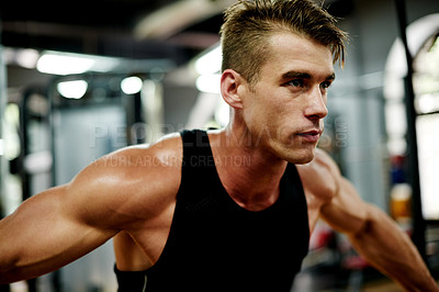 Buy stock photo Fitness, workout and man in gym with machinery, exercise or training for body strength. Weight lift, challenge or athlete in studio with equipment, muscle growth or cardio for bodybuilding goal.