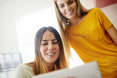 Buy stock photo Collaboration, creative and tablet with business women in office together for design or planning. App, information and reading with happy designer team in workplace for online research or review