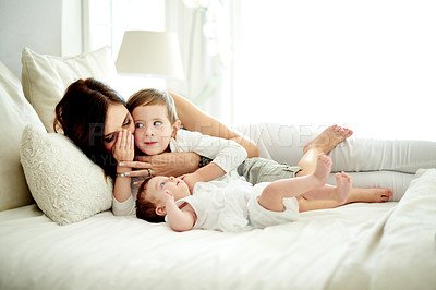 Buy stock photo Happy, mother and children in bedroom with love, care and bonding together for connection. Woman, son and daughter at home with trust, smile embrace and affectionate for special family memory.