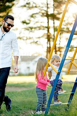 Buy stock photo Nature, jungle gym and father with children in park for holiday, weekend or vacation together. Smile, steps and girl kids with dad for play outdoor on playground for connection or bonding in summer.
