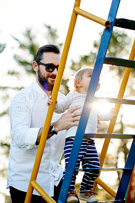 Buy stock photo Nature, jungle gym and father with baby in park for holiday, weekend or vacation together. Smile, trees and girl kid with dad for playing outdoor on playground for connection or bonding in summer.