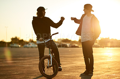 Buy stock photo Fist bump, friends and men with bicycle, outdoor and morning routine with transport on road or trip. Sunrise, cyclist and people with eco friendly bike, greeting and journey on urban street or city