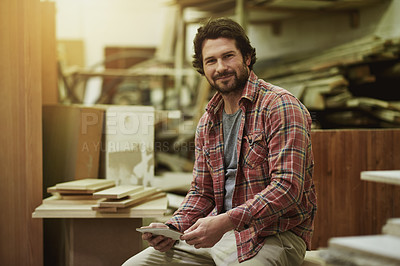 Buy stock photo Carpenter, tablet and smile in portrait in workshop for manufacturing, trade and online plan for project. Carpentry, tech for design and production workspace for woodworking with furniture repair