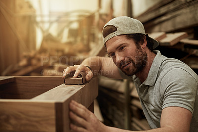 Buy stock photo Carpentry, man and sanding wood in workshop for production, manufacturing and furniture. Carpenter, woodwork and sandpaper for smooth process, craft and joinery in industrial factory with tools