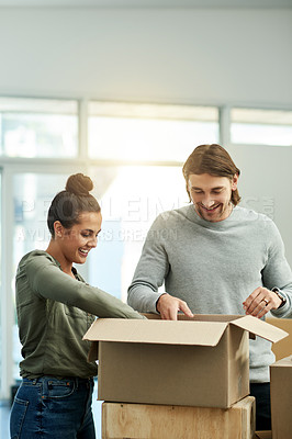 Buy stock photo Packing, boxes and couple in new house for moving, relocation and purchase property. Real estate, relationship and man with woman in apartment with package for rental agreement, mortgage and home