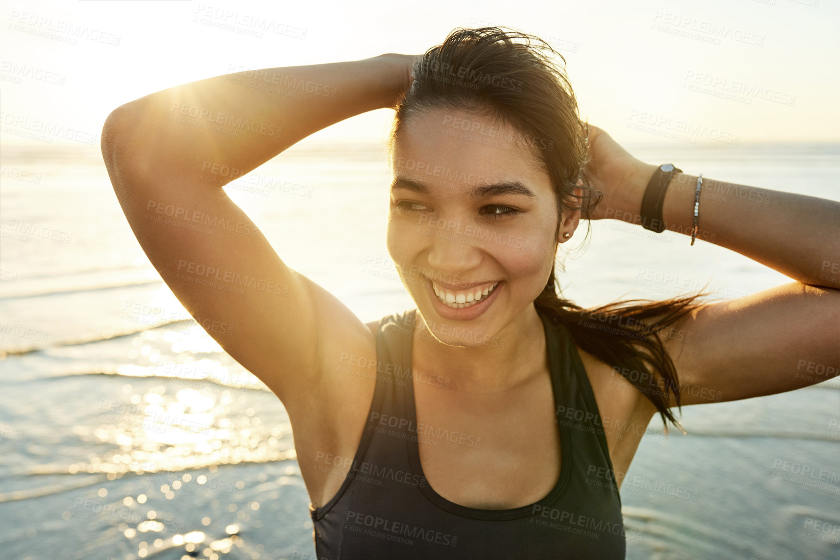 Buy stock photo Stretching, fitness and happy woman at ocean for health, planning workout and relax at sunset. Beach, athlete and confident girl outdoor for training, exercise and thinking of wellness or reflection