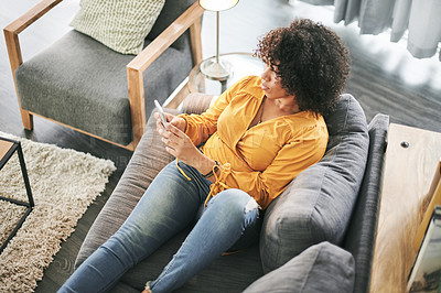 Buy stock photo Home, above and woman on sofa, smartphone and message to contact, social media and relax. Apartment, cellphone and person on couch, typing and communication with connection, online reading or texting