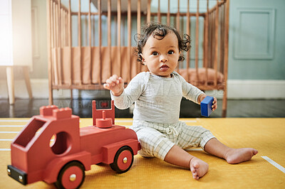 Buy stock photo Baby boy playing with wooden car toys on floor in nursery, childhood growth and creative development. Kids truck, blocks and games for education, montessori learning and coordination of motor skills
