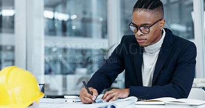 Buy stock photo Architect, blueprint and black man with design in office for floor plan, civil engineering and draft. Glasses, writing and engineer person at workplace for planning, zoning laws and building safety