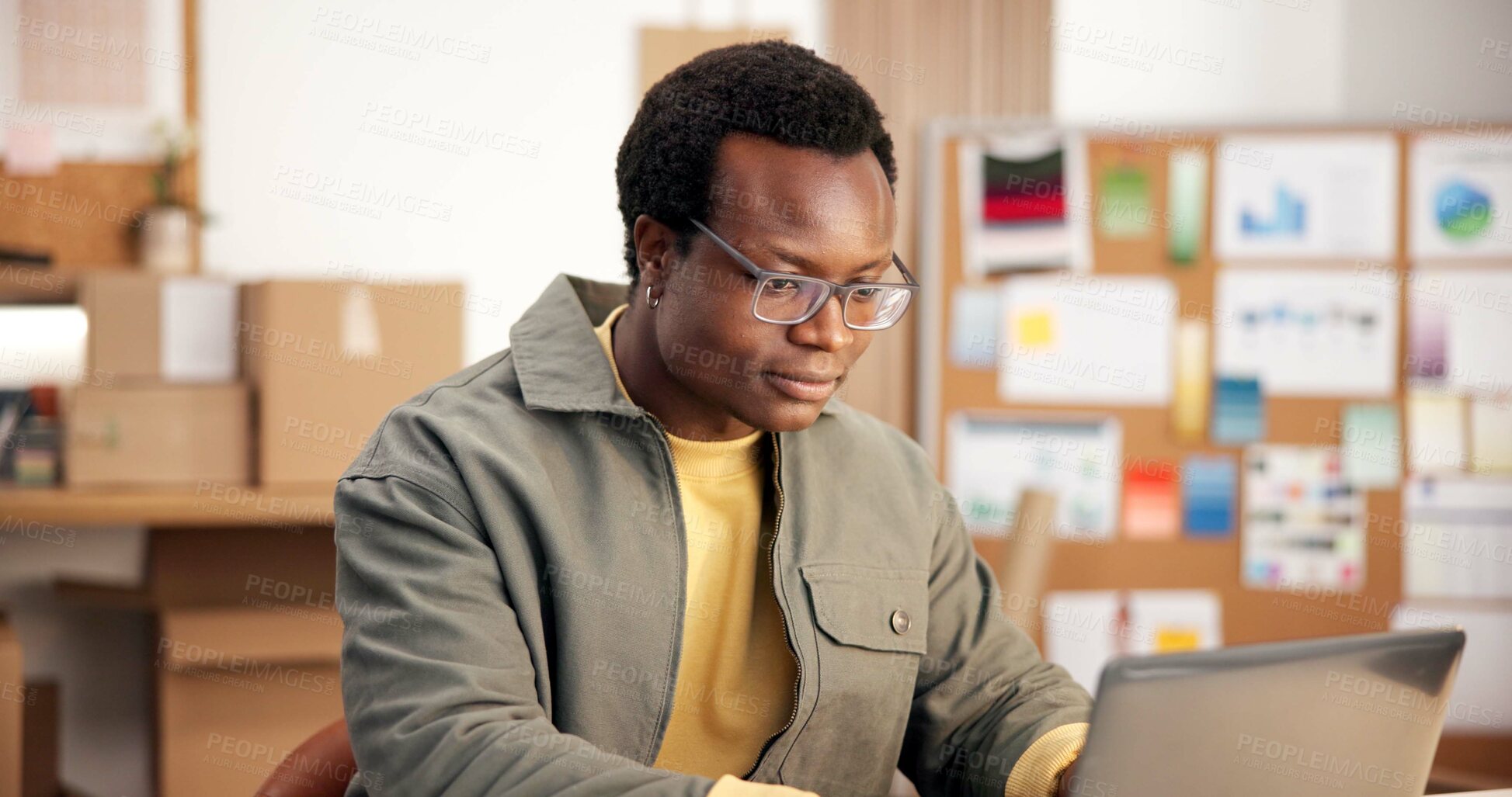 Buy stock photo Black man, laptop and research in small business for logistics, order management and feedback. Entrepreneur, smile and PC in office for inventory control, website update and distribution schedule