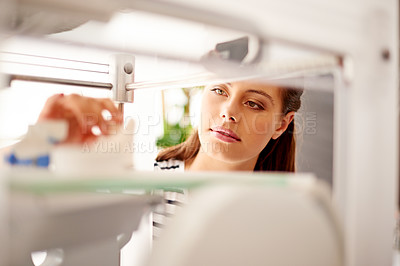 Buy stock photo Serious, employee and woman with 3D printer, creative and graphic designer with software for project. Business, planning and person with tech for digital design, machine and custom printing in office