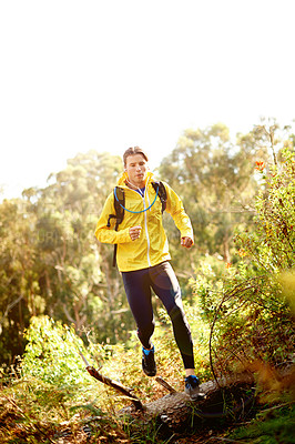 Buy stock photo Hiking, running and man in nature for adventure, trekking and journey for wellness on mountain. Sports, hiker and person outdoor for training, workout and exercise for health, performance and fitness