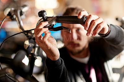 Buy stock photo Bike repair, fixing and man with handle, workshop and maintenance with inspection. Worker, person and employee with bicycle, startup and check brakes with sustainability, small business and safety