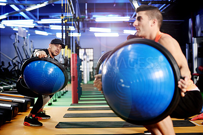 Buy stock photo Personal trainer, squat or people in gym class with ball exercise for training, workout or core strength. Teaching balance, coach or athlete in club with equipment for fitness, body health or support