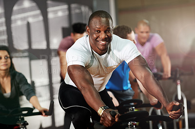 Buy stock photo Portrait, spin class or man on cycling bike in training or exercise for wellness, health or fitness. Athlete, smile or active people on bicycle machine for workout, body or challenge in gym community