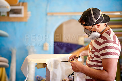 Buy stock photo Surfboard, plastic and man with mask in workshop for manufacturing, production and customization. Craft, small business and person with equipment for repairs, maintenance and renovation in factory