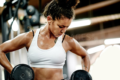 Buy stock photo Exercise, woman and dumbbell for bodybuilder, workout and fitness in gym for health and power. African person, weightlifting and strong for muscle development, challenge or training for wellness