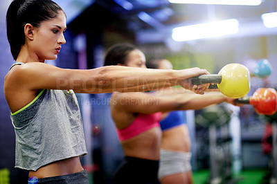 Buy stock photo Gym, exercise and woman in fitness class with kettlebell for strength training, cardio and wellness. Health club, active or person in workout with weights for healthy body, goal or physical wellbeing