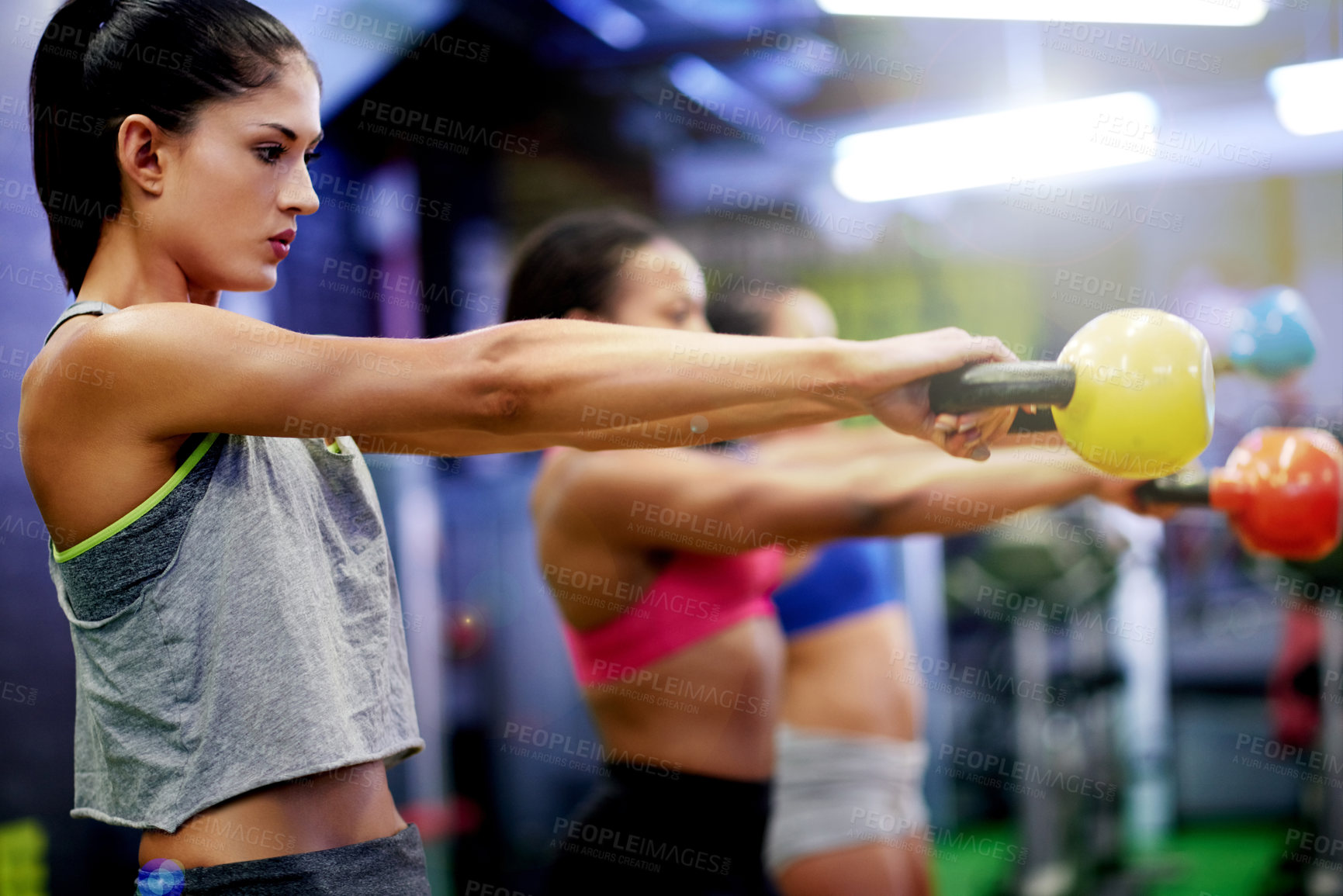 Buy stock photo Gym, exercise and woman in fitness class with kettlebell for strength training, cardio and wellness. Health club, active or person in workout with weights for healthy body, goal or physical wellbeing