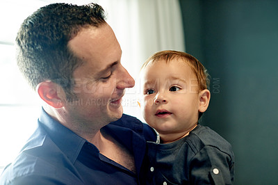 Buy stock photo Happy, bonding and father with baby in home with love, care and connection together on weekend. Smile, family and dad holding boy kid for growth and childhood development in living room at house.