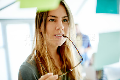 Buy stock photo Creative woman, thinking and schedule planning with glasses in office for brainstorming or ideas. Female person, employee or business planner with contemplation for project reminder, agenda or tasks