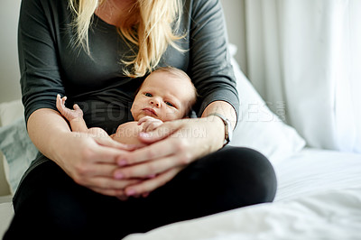 Buy stock photo Mother, baby and relax in bed in home with affection, bonding or relationship growth for love of family. Portrait, calm and newborn in arms of woman for moment or care with new mom for motherhood