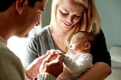 Buy stock photo Smile, holding hands and parents with baby in home with calm, care and love in family time. Bonding, happy and newborn sleeping with mother and father for support, comfort or trust together in house.