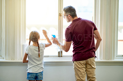 Buy stock photo Father, child and clean window in home for learning hygiene, maintenance and bonding together. Parent, girl and wipe glass for chores with dad for help, teaching housekeeping and back of family