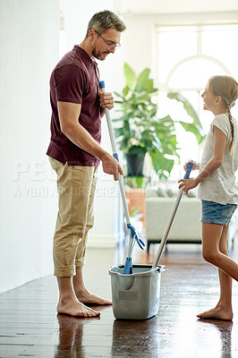 Buy stock photo Father, child and mop floor for cleaning, learning hygiene and home maintenance together. Dad, girl and bucket for chores with parent for help, teaching housekeeping and talk with happy family