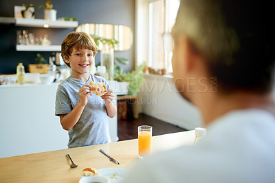 Buy stock photo Home, breakfast and father with boy, smile and bonding together with nutrition, kid and juice. Family, apartment and dad with happy son, morning food and parent with child, healthy and organic meal