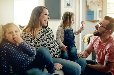 Buy stock photo Happy, parents and children on couch with laughing, interaction and bonding for special family memory. Smile, people and daughters in home with portrait, pregnant mother and love in living room.