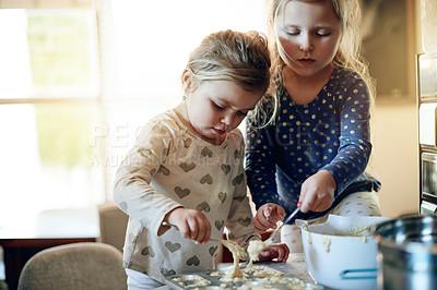 Buy stock photo Baking, fun and kitchen with girl children in home together for learning or growth. Cooking, development and messy with sister kids at counter in apartment for ingredients or recipe as baker family