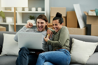 Buy stock photo Credit card, fist pump and laptop with couple on sofa in living room of new home together for celebration. Computer, online shopping and success with people in apartment for purchase on moving day