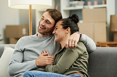 Buy stock photo Couch, real estate and happy couple hug in new home for love, property investment or mortgage. Moving, man and woman embrace in living room for relax, relocation or laugh with partner in dream house