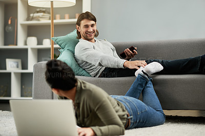 Buy stock photo Home, couple and happy with laptop, talk and bonding in lounge, conversation and relax in apartment. Online, people and tech for movies, man and smile with woman, break or rest on weekend in house