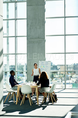 Buy stock photo Meeting, whiteboard and woman with business people in office for strategy, finance review and planning. Corporate, space and workers in presentation for financial growth, feedback and proposal ideas