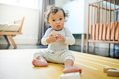 Buy stock photo Baby boy, blocks and playing on floor in nursery, childhood growth and development. Kids, educational wooden toys and games for montessori learning, cognitive puzzle and motor skills in room at home
