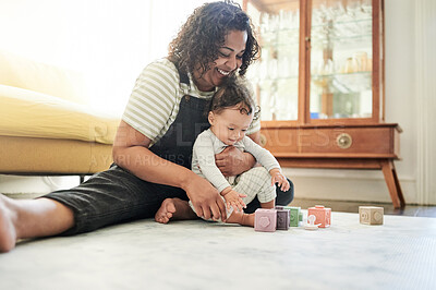 Buy stock photo Mother, baby and play with toy blocks in home, learning and education in house. Development, care and happy mama playing with child toys, newborn or toddler while bonding and having fun together.