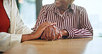Senior, woman and holding hands with comfort for empathy, trust or emotional support in home. Female people, listening or understanding with love or hope for sympathy, elderly care or help in house