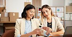 Logistics, phone and happy women with online app for small business management, schedule or order. Female people, employees or colleagues with smile on technology for delivery update in workplace