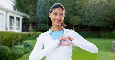 Buy stock photo Portrait, woman and heart hands in backyard with fitness, smile and satisfaction for vitality goals. Happy, person and active outdoor by home with love sign, emoji and positive attitude for wellness.